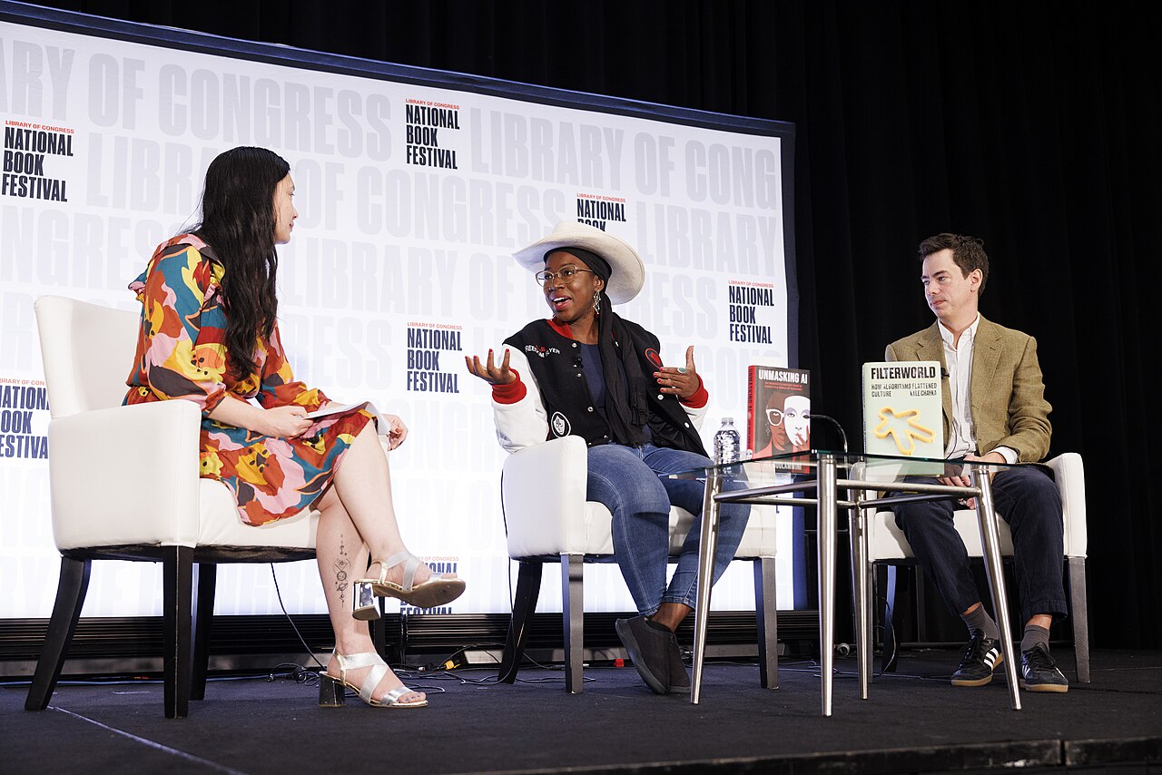 Joy Buolamwini, center, speaks between two fellow panelists at the National Book Festival.
