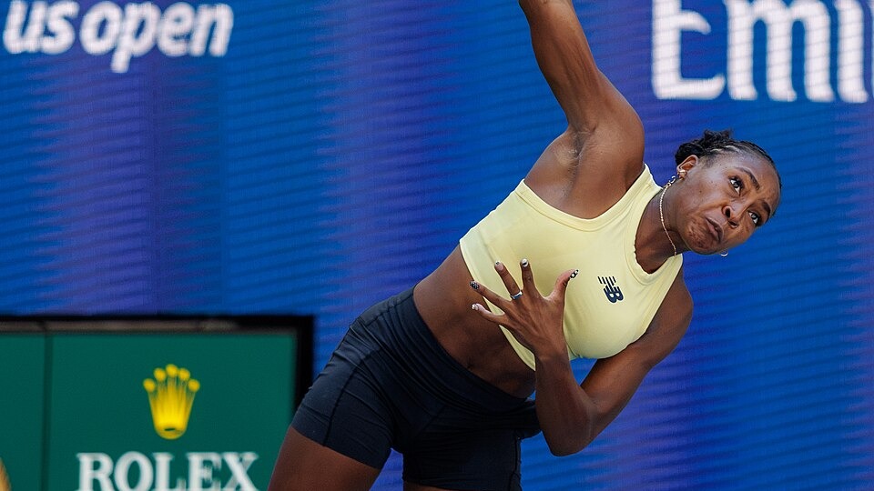 Coco Gauff extending her arm while serving during practice at the 2026 US Open.