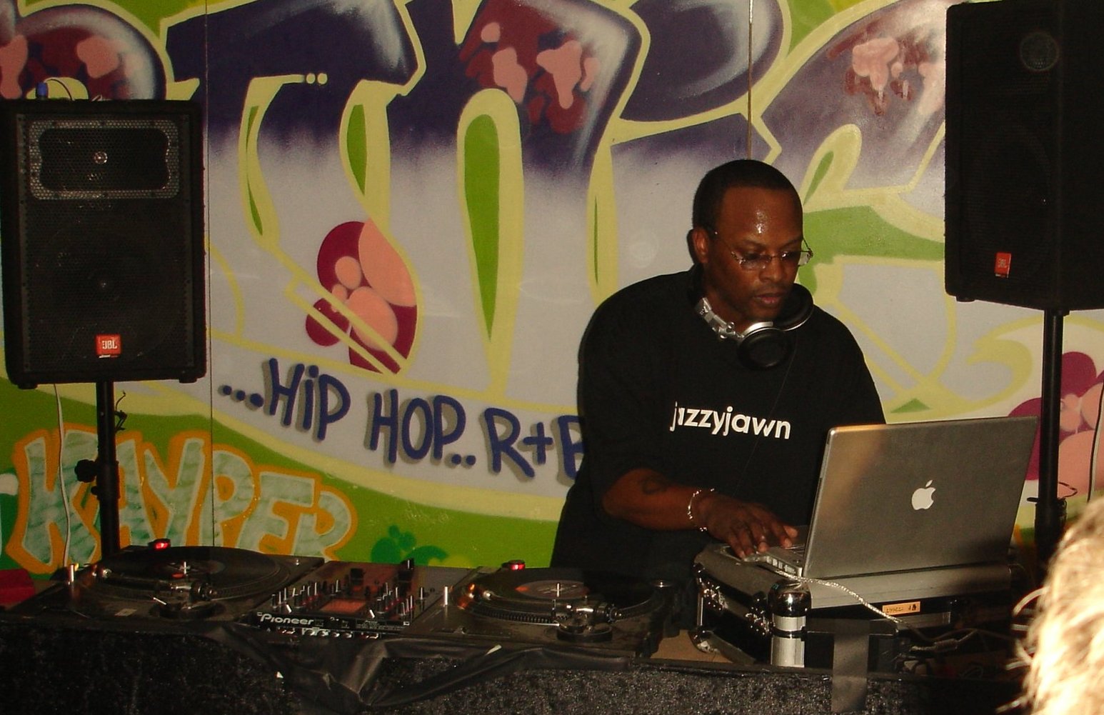 DJ Jazzy Jeff performing behind turntables and a laptop in Cambridge, England, in 2005