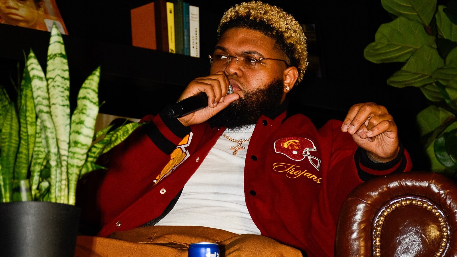 Druski seated with a microphone during the 2025 Essence Festival of Culture