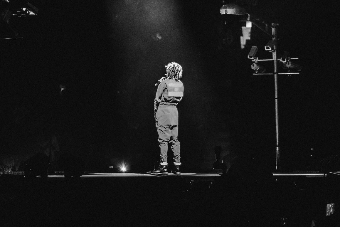 J. Cole performing onstage during the 4 Your Eyez Only Tour in Toronto