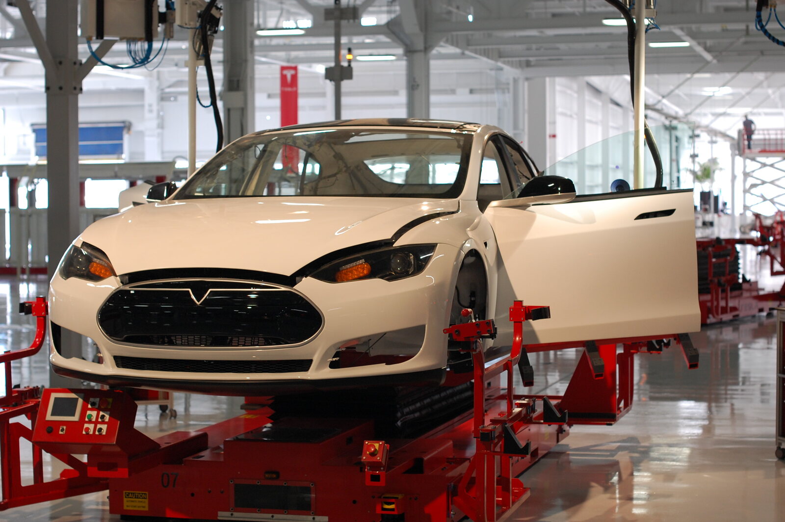 A white Tesla Model S on the production line inside the company’s Fremont factory.