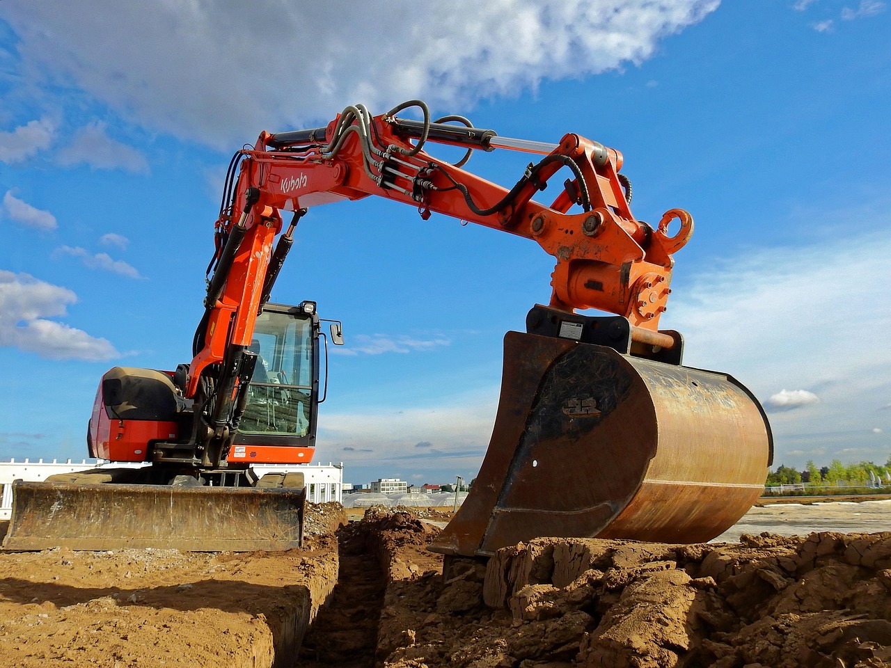 Heavy construction equipment operating at a construction site.