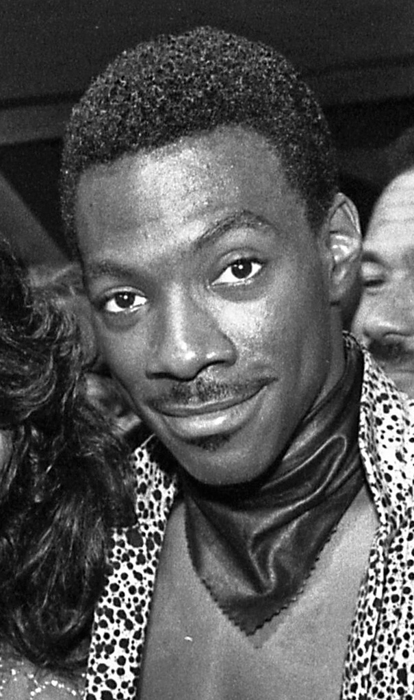 A black-and-white photograph of a young Eddie Murphy in 1984.